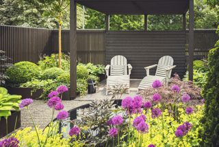 dark slatted fencing in a patio area