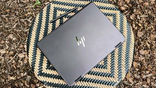 HP Spectre x360 outside on chair