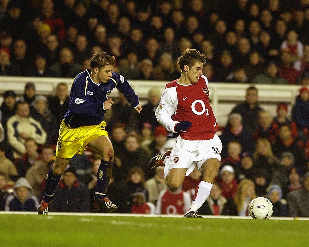 LONDON - JANUARY 4: David Bentley of Arsenal skips past Bobby Ford of Oxford United during the FA Cup Third Round match between Arsenal and Oxford United held on January 4, 2003 at Highbury in London, England. Arsenal won the match 2-0. (Photo By Shaun Botterill/Getty Images)