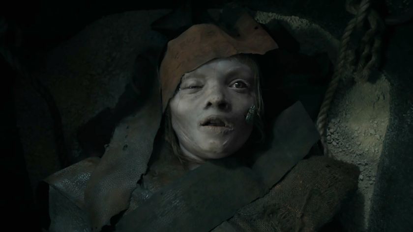 A young girl swaddled in rags awakening from death