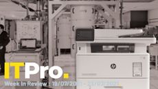 An HP printer overlaid on a background of IBM's Q computer