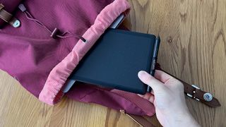 Slipping the One by Wacom into a rucksack