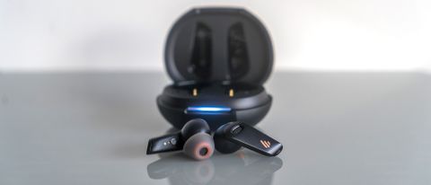 The Edifier NeoBuds S earbuds loose in front of case.
