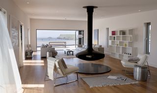 minimalist living room with hanging wood burner