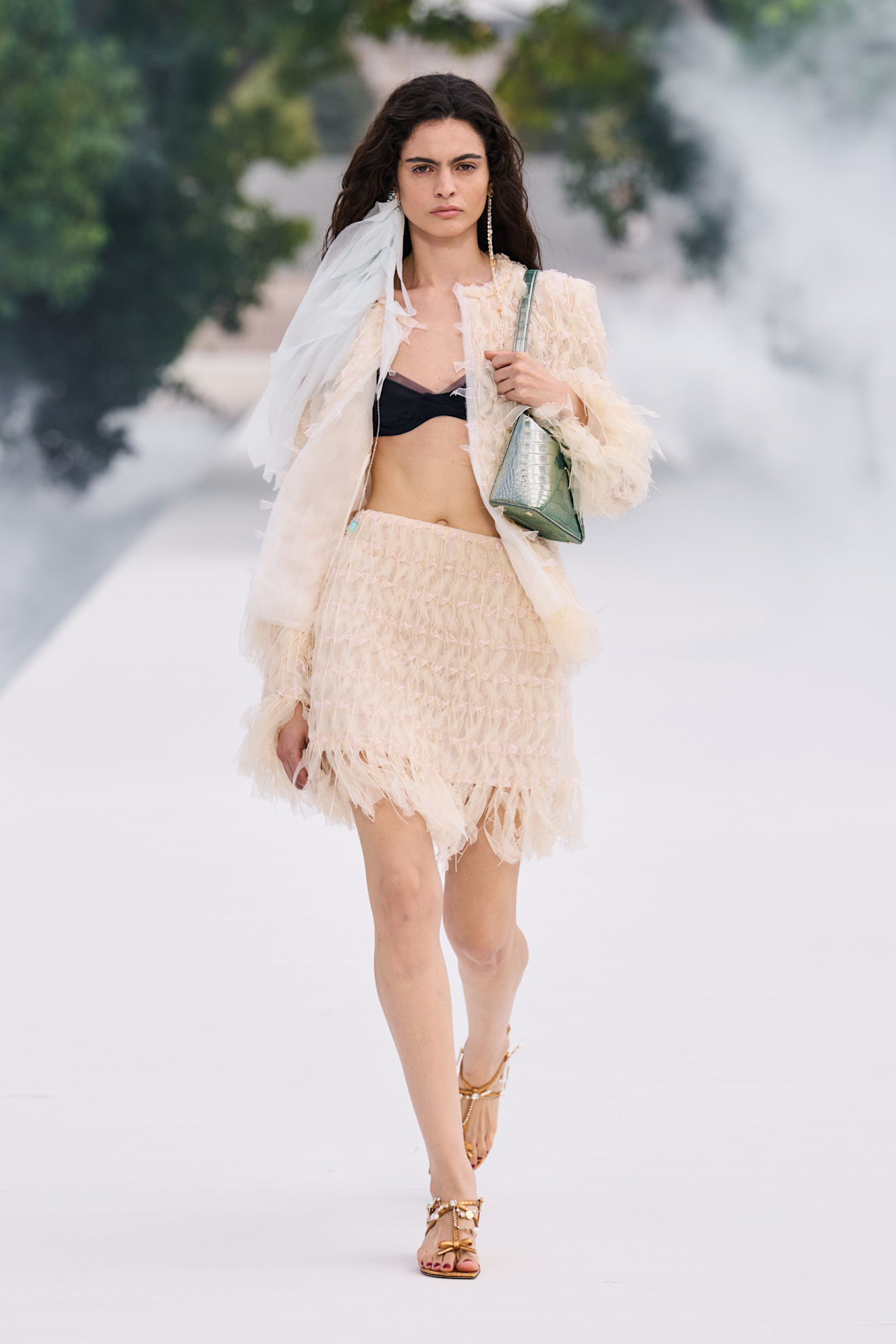 Spring/summer 2027 model wearing a bra top on the runway during fashion month.