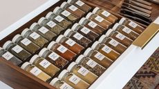 Organized spices in kitchen drawer