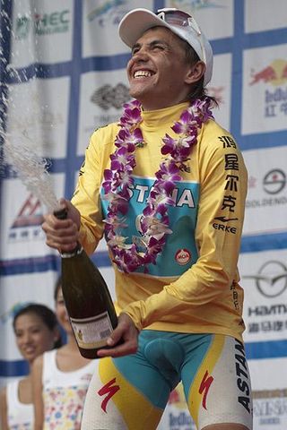 A winning spray: Tour winner Valentin Iglinskiy (Astana) releases the champers on the podium in Sanya.