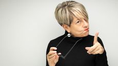 An older woman looks very stern with a "don't do it" expression.