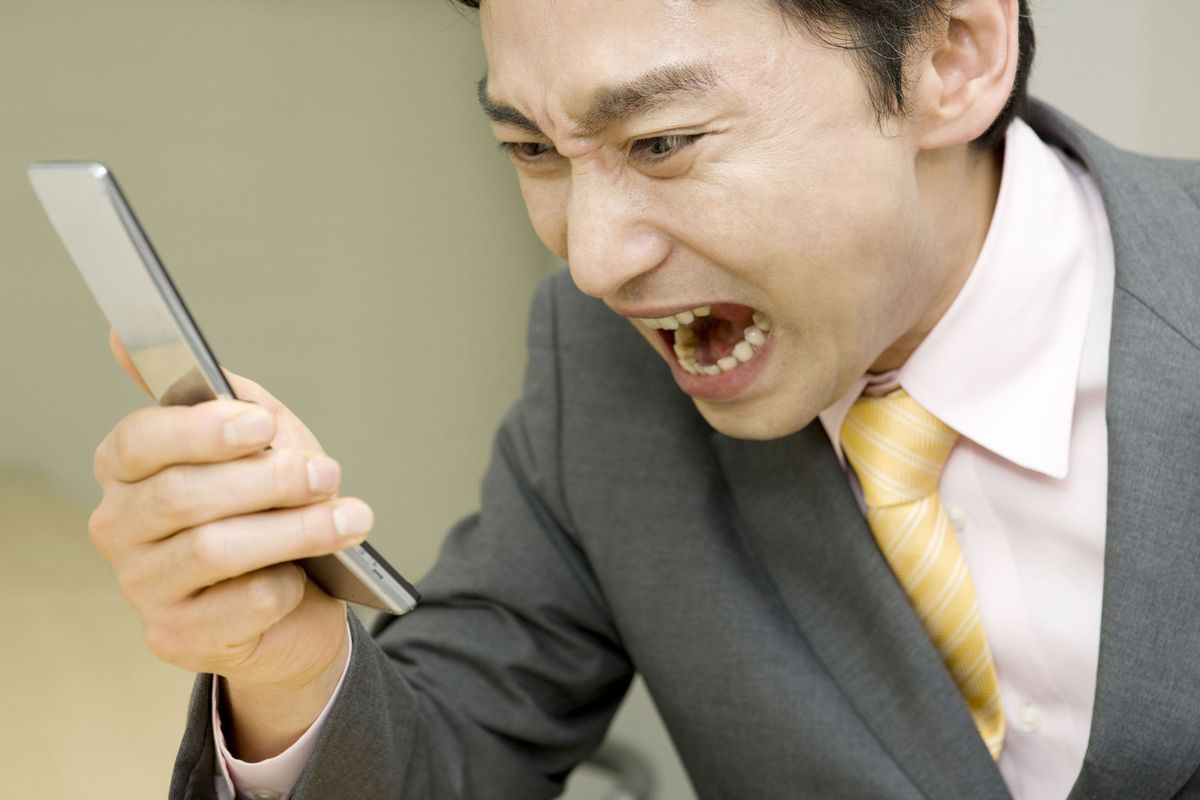 man yelling at phone