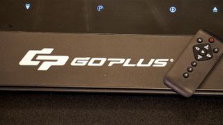 A photo of the goplus walking treadmill with remote