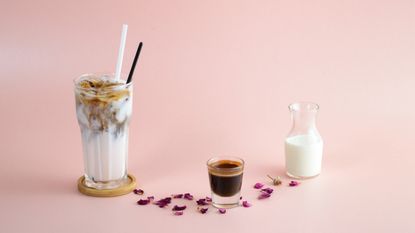 A glass of Iced coffee with milk and syrup - stock photo