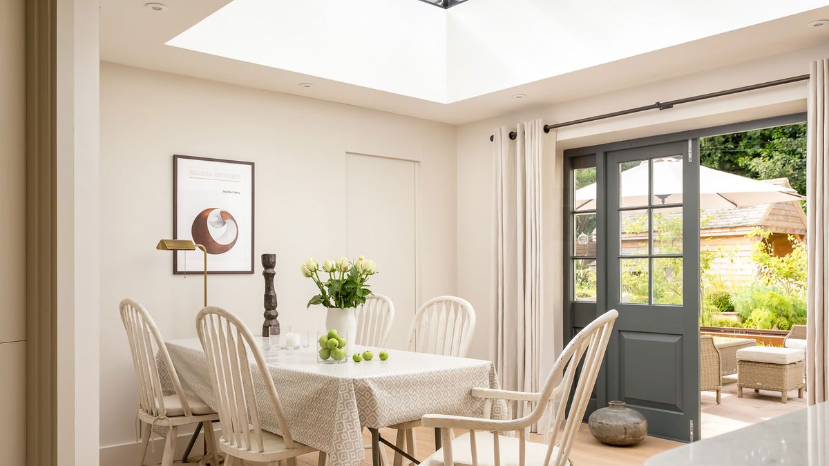 dining area with roof lantern and blue French doors