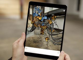 ipad with image of creature on it