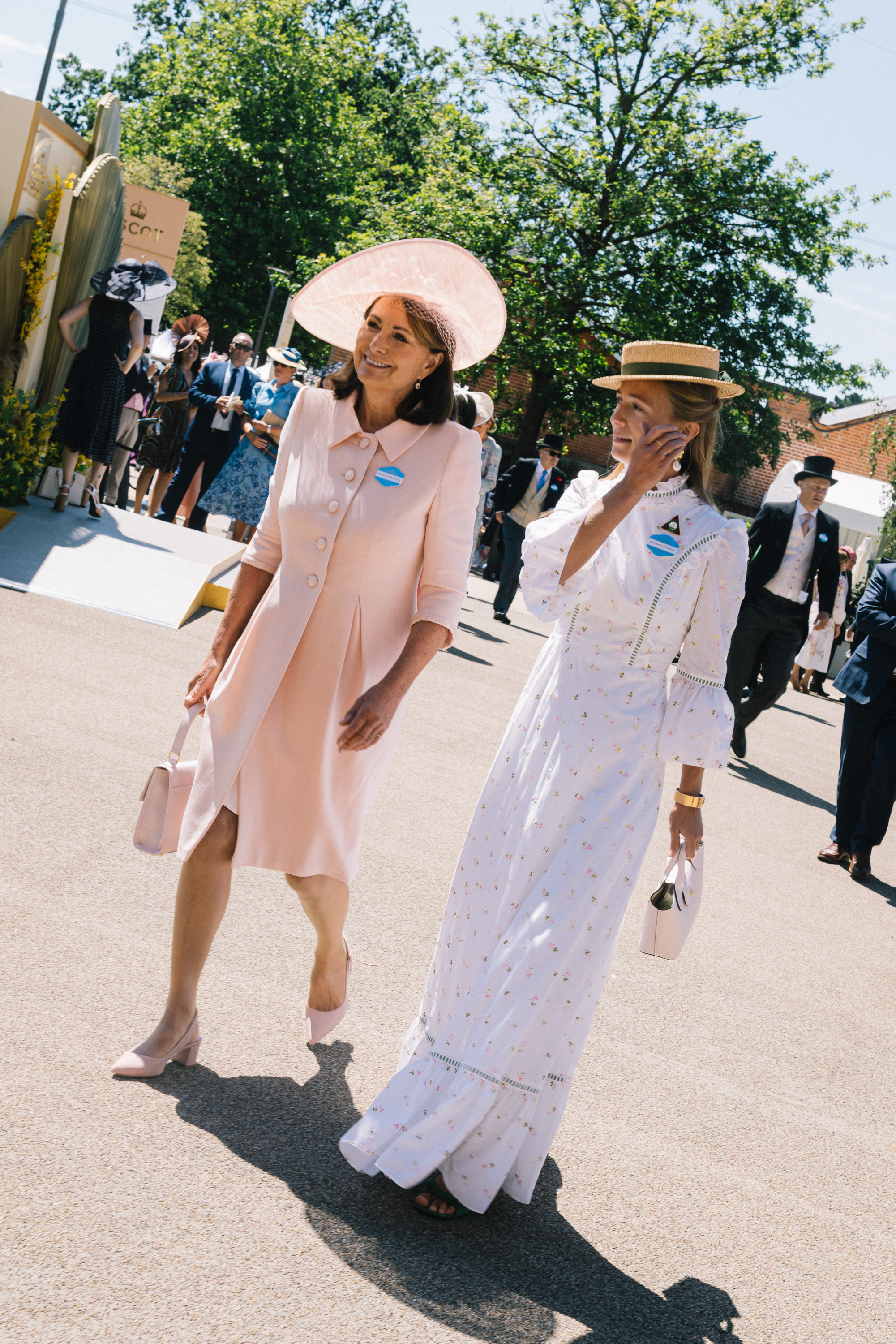 Carole Middleton wears a baby pink dress and matching hat, while carrying a top handle bag in the same shade to attend Royal Ascot 2026