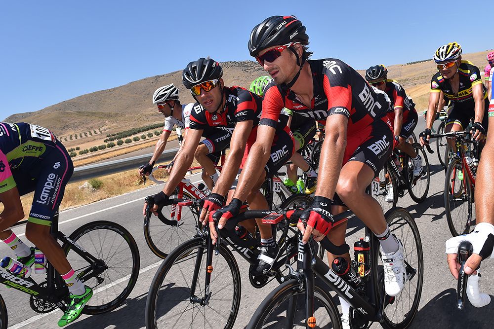 Ama&euml;l Moinard and Peter Velits talk in the peloton