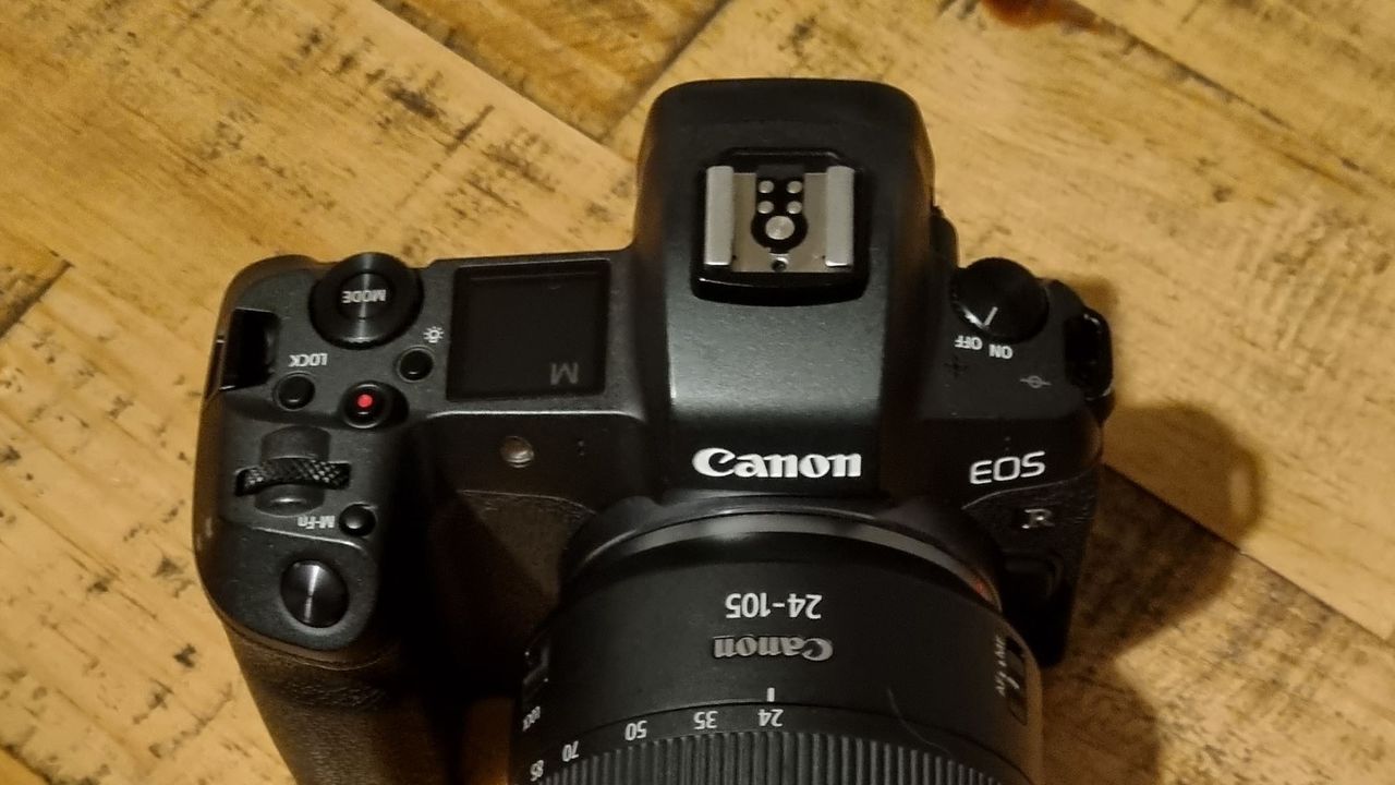 Top view of the camera on a wooden table
