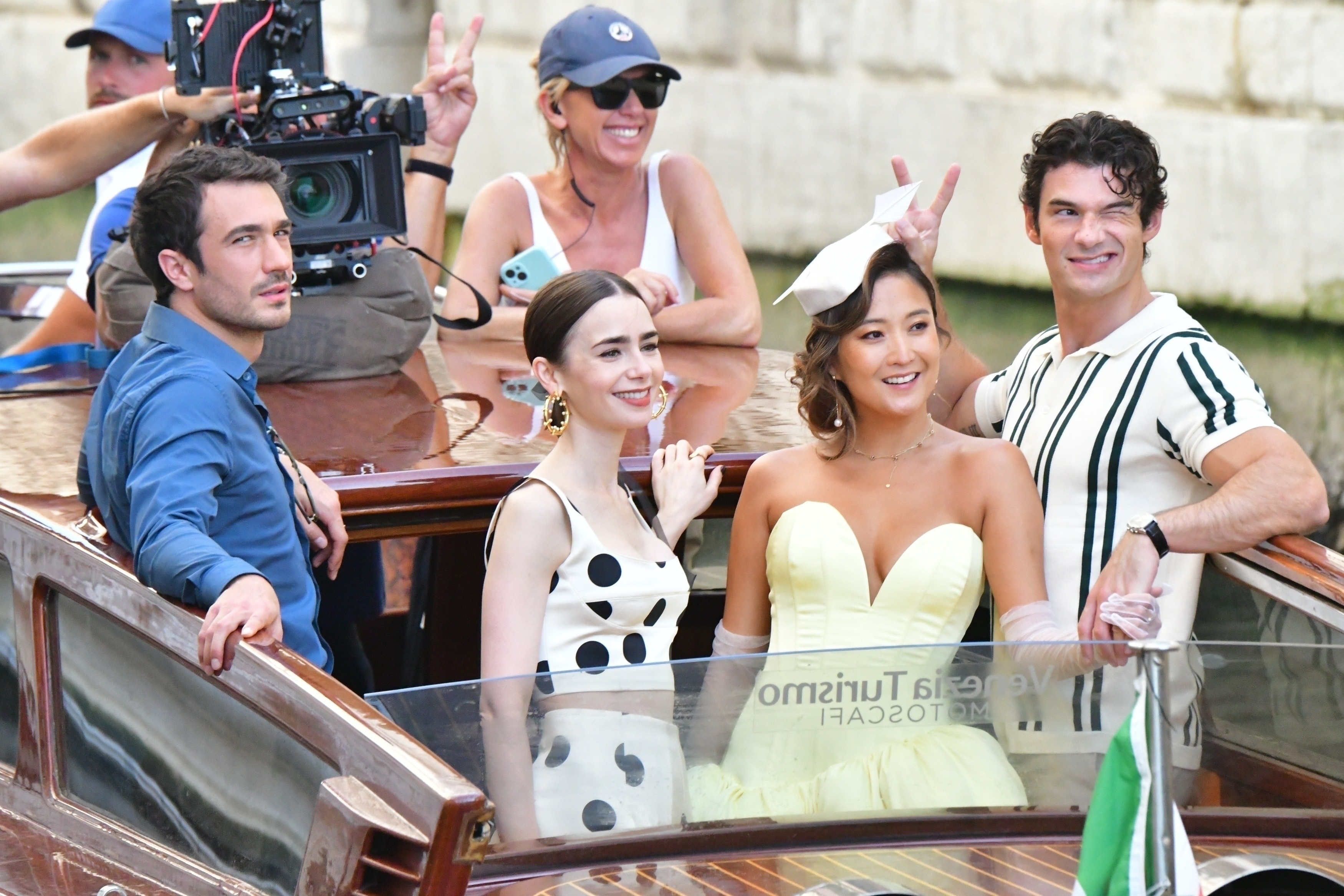 Lily Collins films Emily in Paris wearing a white and black polka dot dress