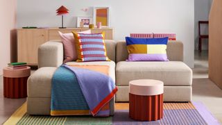 Ikea and Raw Color collaboration: sofa with colourful cushions, throw and pouf