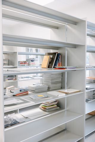 Metal book shelves with fashion books and magazines