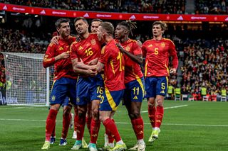 Spain players celebrate after scoring in a friendly against Brazil at the Santiago Bernabeau in Madrid, March 2024.