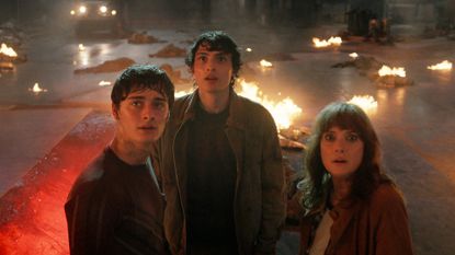 Will, Mike, and Joyce standing near a rift to the Upside Down in Stranger Things season 5