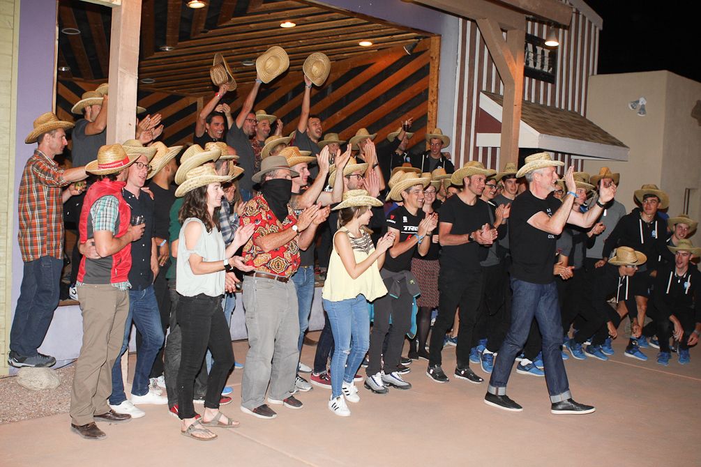 The riders, staff and guests gather for a photo during 'Western Night'
