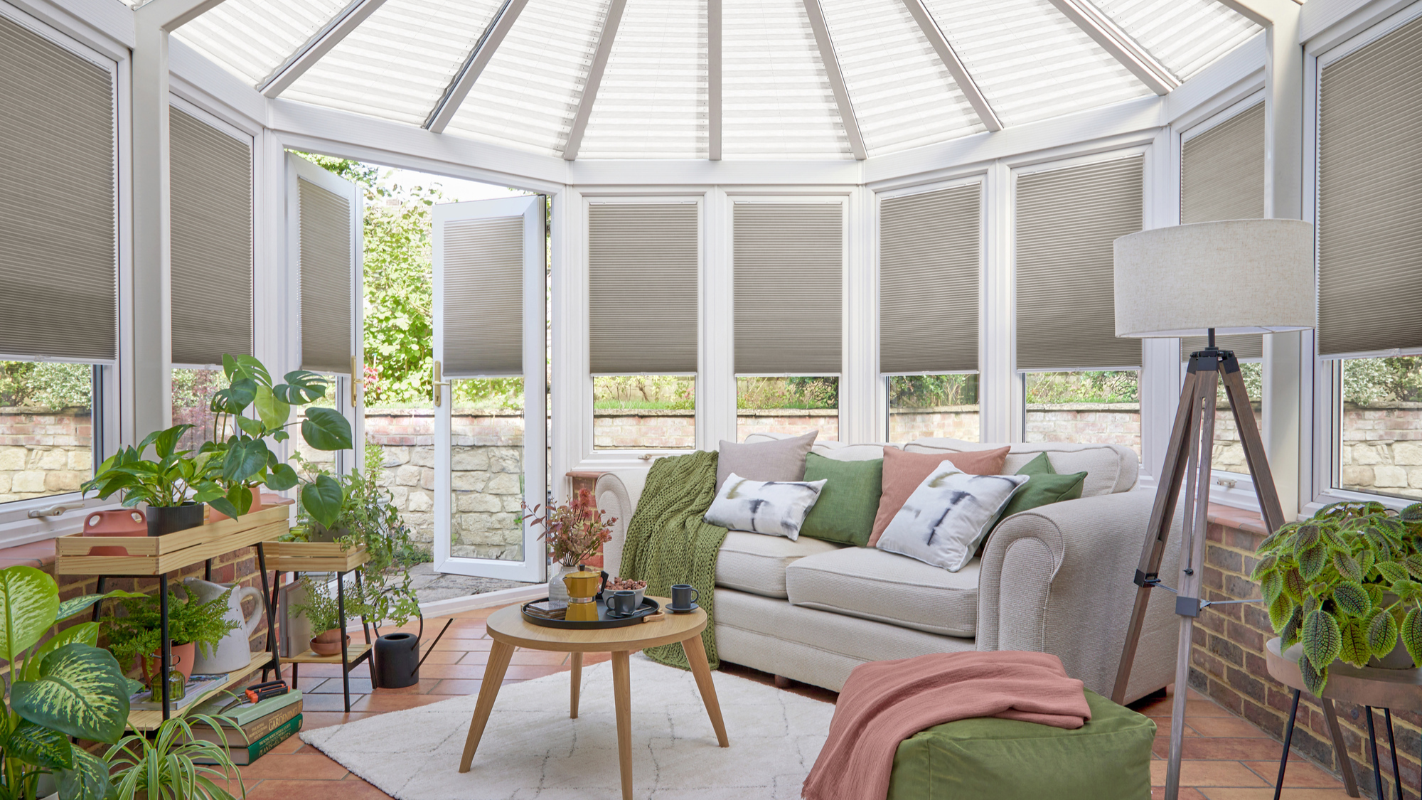 conservatory with plants, sofa and coffee table