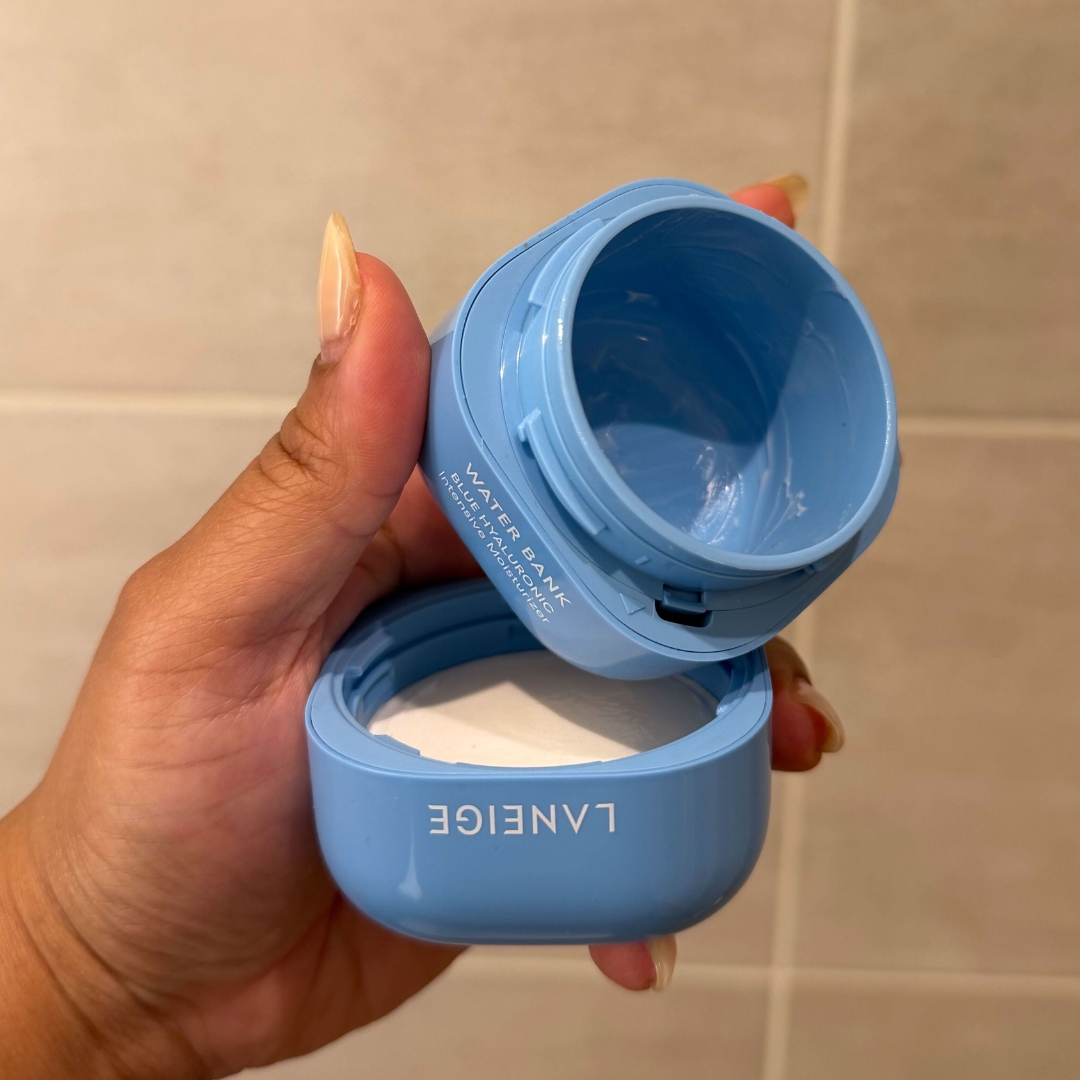 Hand holding an empty blue tub of Laneige Water Bank Blue Hyaluronic Acid Intensive Moisturiser