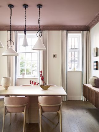 dining room with pink painted ceiling