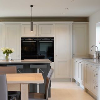 kitchen with white cabinet and dining area