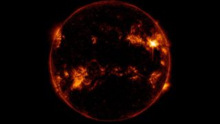 NASA's Solar Dynamics Observatory captured this image of a solar flare — as seen in the bright flash in the upper right portion of the image — on March 31, 2022.