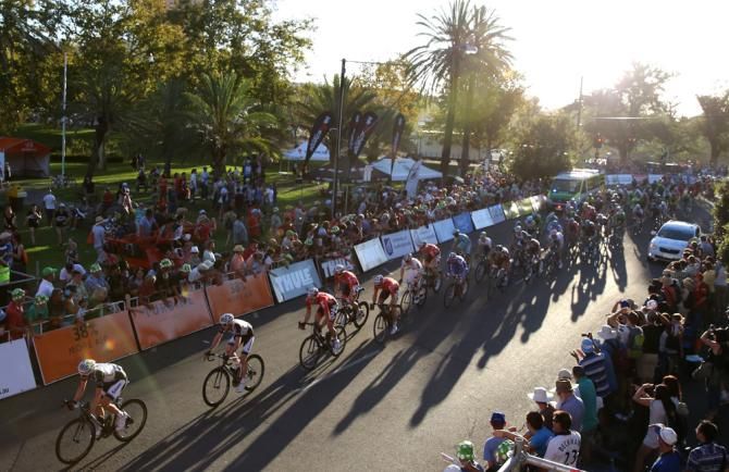 The peloton pass through the big crowds