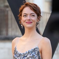 Emma Stone looks away from the camera at the Louis Vuitton Cruise 2026 show in Avignon