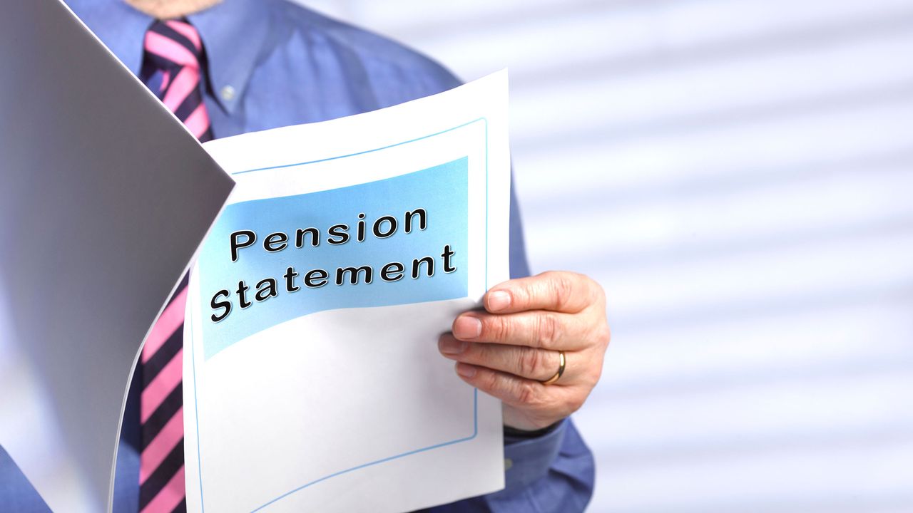 A man reads a document titled &amp;quot;Pension Statement.&amp;quot;