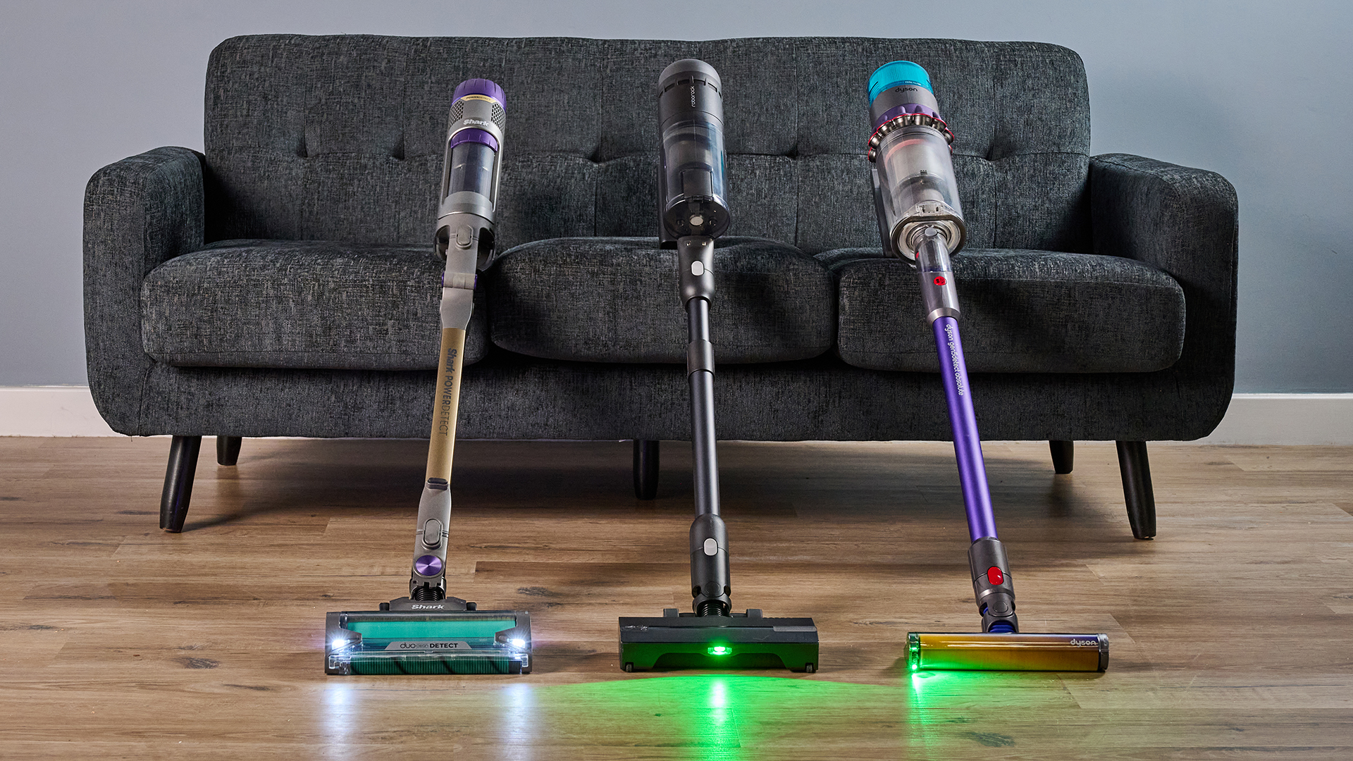 Shark PowerDetect, Roborock H60 Hub Ultra and Dyson Gen5detect vacuums with their headlamps illuminated