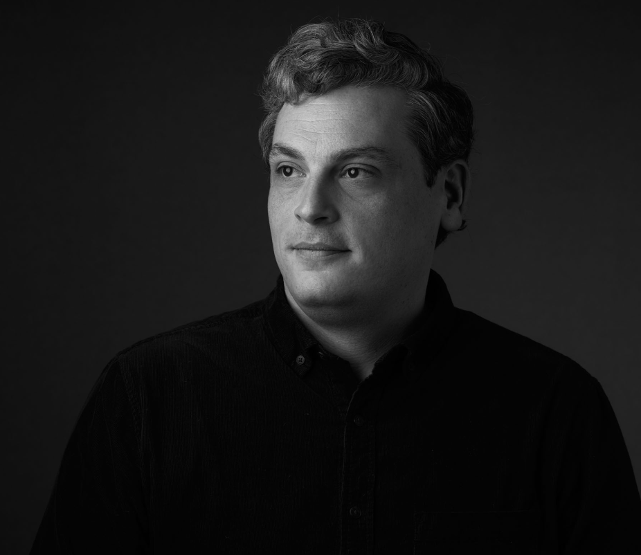 black and white head and shoulders shot of a man
