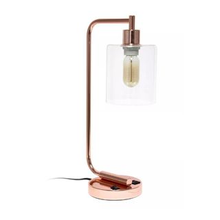 A rose gold desk lamp