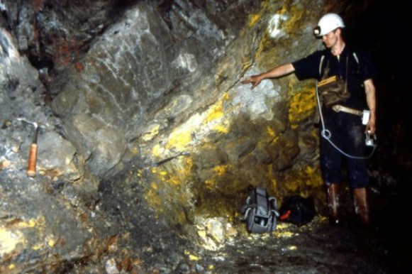 A &quot;fossil&quot; natural nuclear reactor site in the Okio region of Gabon. The large uranium deposit present underwent nuclear fission on and off for hundreds of thousands of years some 2 billion years ago. The yellow rock is uranium oxide. 