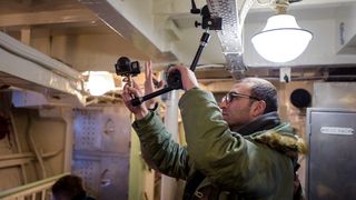 Wargaming's film crew setting up a camera for a walk and talk scene in the ship's forward mess.