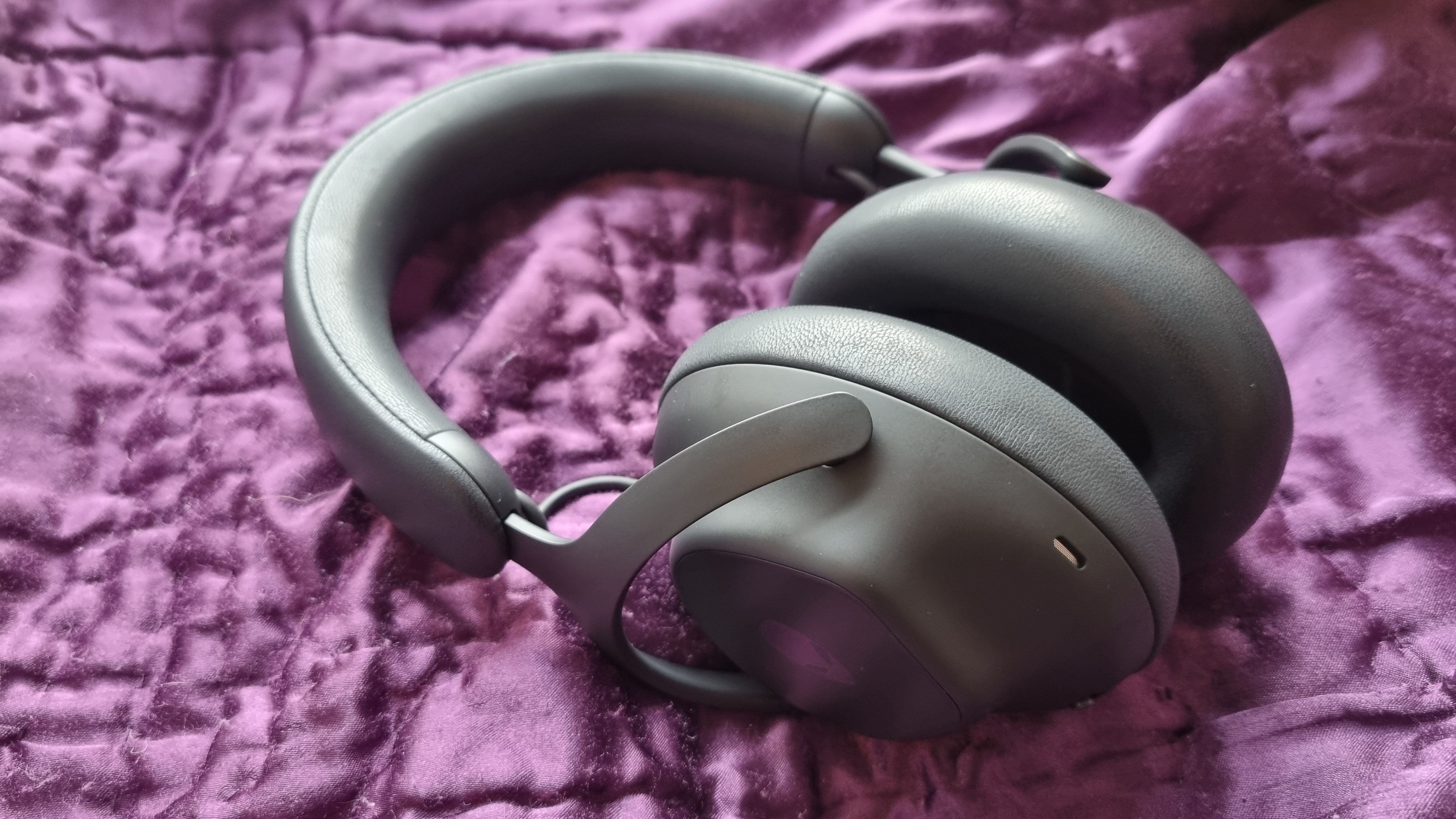 The Alienware Pro Wireless Gaming Headset on a purple background.