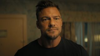A close-up of Alan Ritchson in Reacher. 