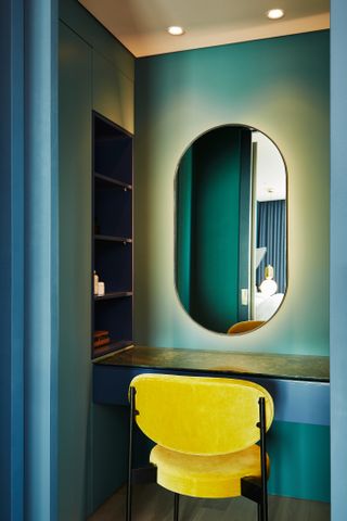 Dressing table with mirror and yellow chair