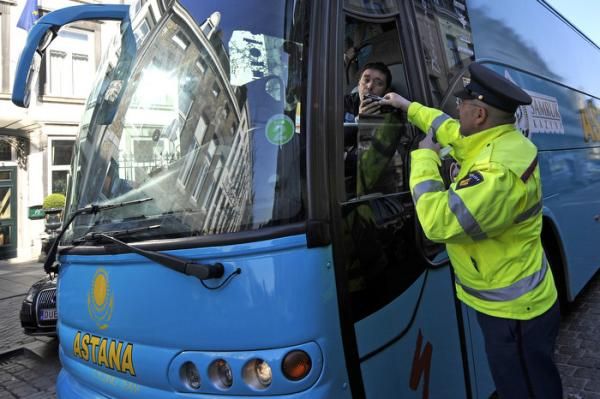 The driver of the Astana team bus gets an alcohol breath test at the Amstel Gold Race.