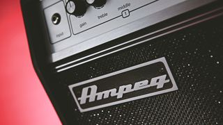 Best bass amps: Ampeg bass amp on red background