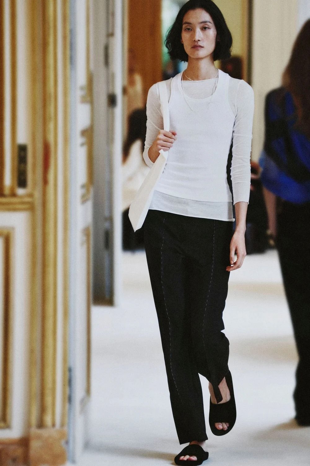 A model walking in The Row's Summer 2027 show during Paris Fashion Week.
