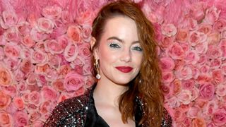 Emma Stone wearing sparkling silver eyeliner flicks with red lipstick