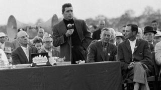 Gary Player speaks after his 1961 Masters win as Charles Coe listens