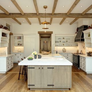 kitchen room with wooden flooring and white wall