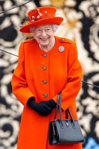 Queen Elizabeth II (Patron of the Commonwealth Games Federation), wearing her Nizam of Hyderabad diamond rose brooch, attends the launch of the Queen's Baton Relay