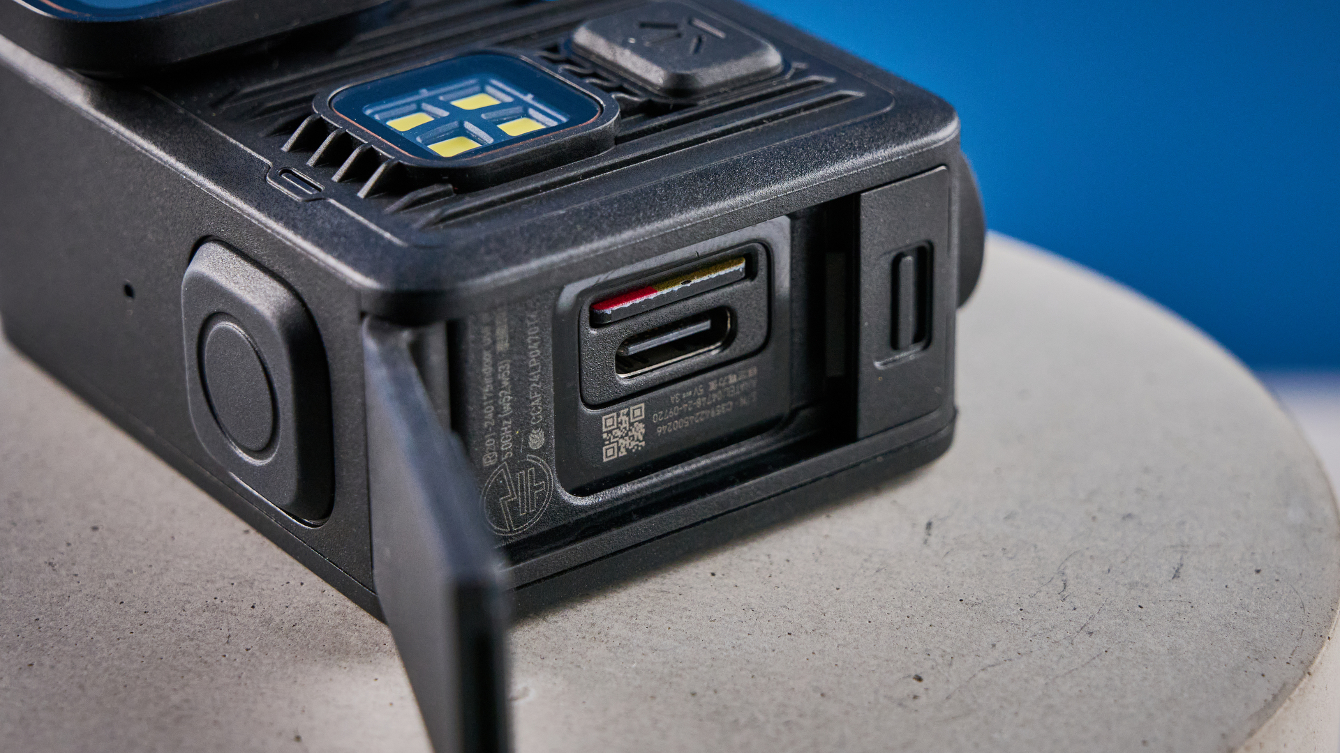 The GoPro LIT Hero against a blue background